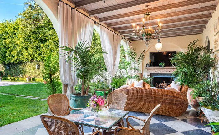 The outdoor dining loggia is the ideal spot to entertain at this legendary Hancock Park estate by A.K. Kellogg