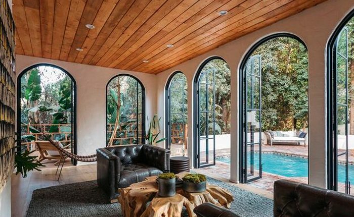 Hollywood Hills Spanish Estate with abundant natural light, dramatic double height ceilings.