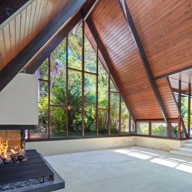 Mid Century A-FRAME | Your Own Tropical Retreat! Built in 1958, this Beverly Hills home features post and beam construction, soaring ceilings and walls of glass that overlook the pool and lush landscaping. The unique residence graced the pages of Architectural Digest in 1965 and is poised for its next chapter. The owners set out to create an experience in the home bringing influence from their many trips to Hawaii, incorporating island elements, volcanic rock, waterfalls, and interior planters in to the space. If it’s been your dream to live in a home that feels like a lush island resort, it doesn’t get much better than this. Link in our bio.⁠
.⁠
Contact Beyond Shelter for a private showing of this special mid century A-frame. ⁠
.⁠
.⁠
.⁠
Listed by Sally Forster Jones⁠